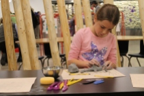 There's tons to do in the Art Studio, like build and fire your own clay piece to take home!