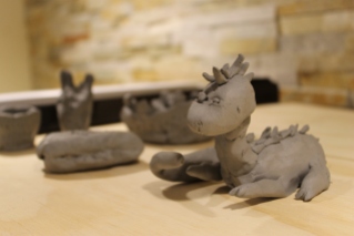 Tiny clay creations await to be fired or glazed, and go home with their creators!